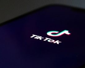 Using TikTok on a smartphone